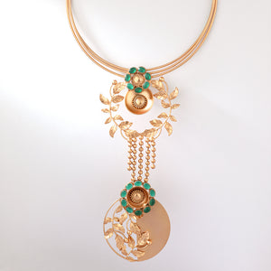 Gold toned serrate and green crystal choker with drop pendant