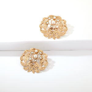 Gold toned serrate and pearl studs