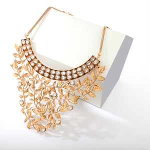 gold toned necklace with serrate and crystal embellishment