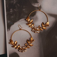 Load image into Gallery viewer, Gold toned serrate and crystal hoops
