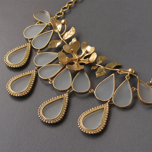 GOLD PLATED NECKPIECE WITH LATIFOLIA, SERRATE LEAVES AND ACRYLIC DROPS