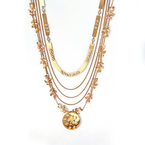 Gold toned layered necklace with serrate and chain-link detailing