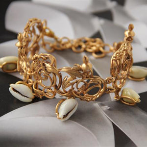 GOLD PLATED CURLED & 5 SHELL BRACELET