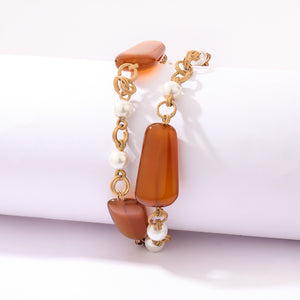 Beaded chain link bracelet with orange chalcedony stones