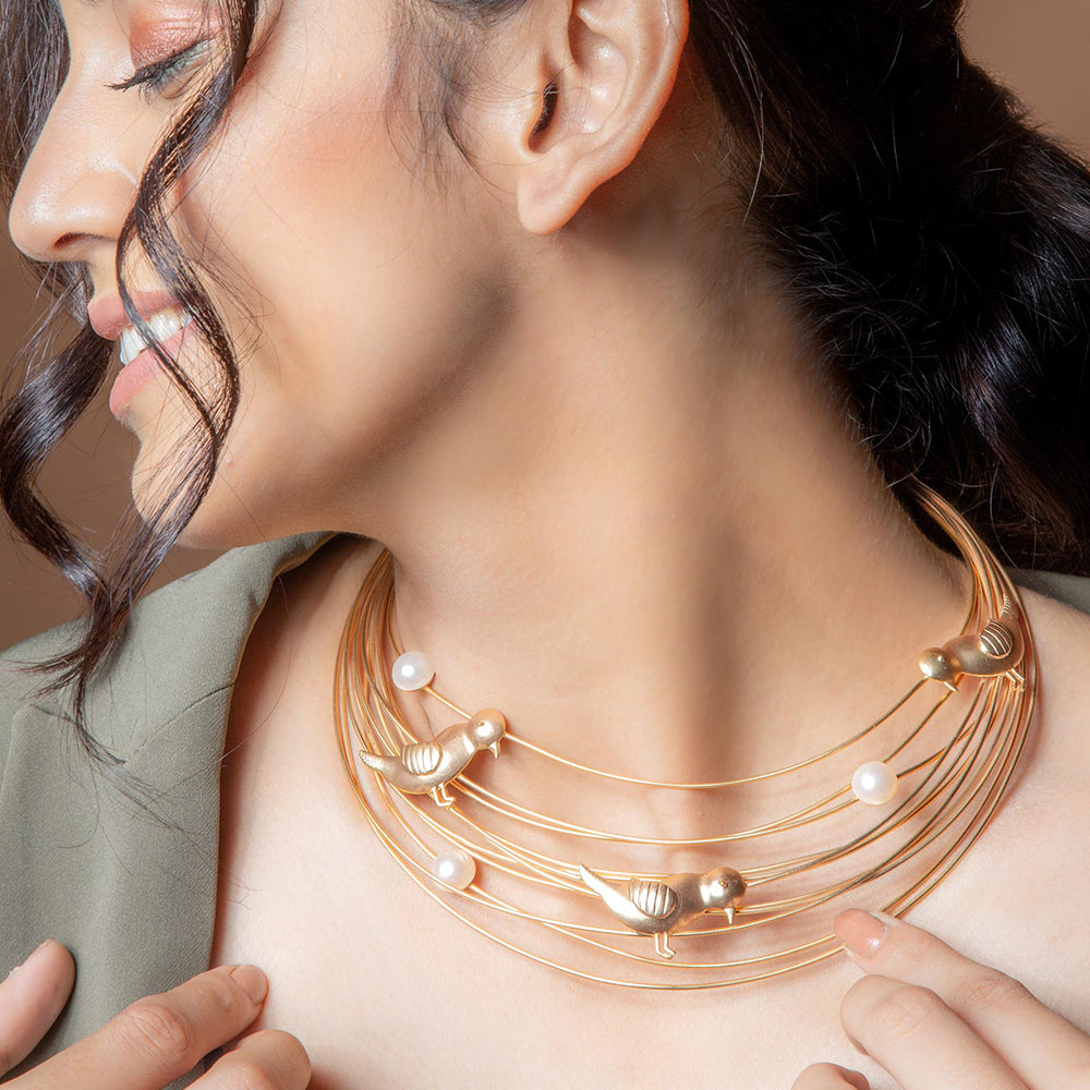 Gold plated necklace with bird motif and pearls worn by neena gupta