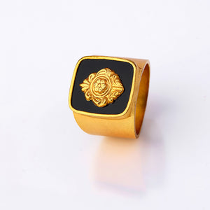 Gold Toned Emblem Ring With Black Acrylic