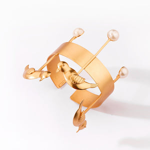 GOLD PLATED CUFF WITH BIRD MOTIF AND PEARLS
