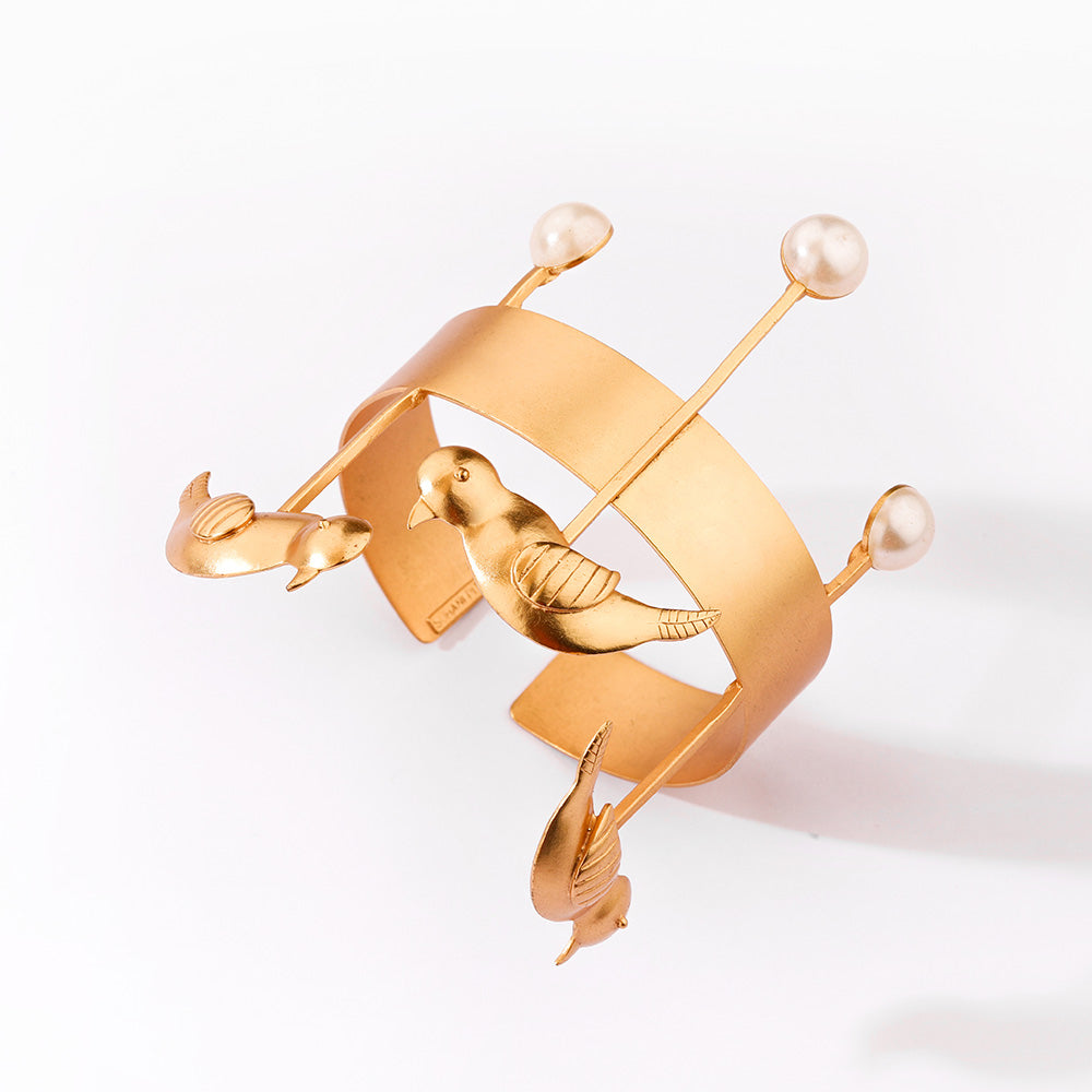 GOLD PLATED CUFF WITH BIRD MOTIF AND PEARLS