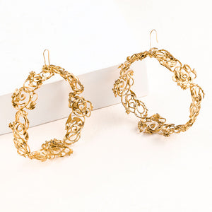 Gold Toned Large Swirl Hoop Earrings worn by Pooja Hegde