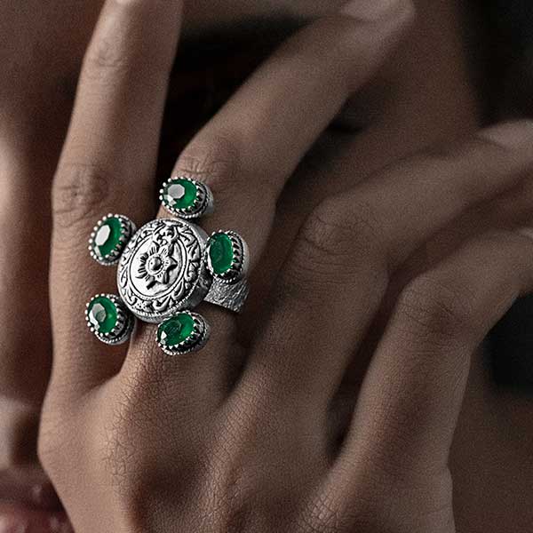 Sterling Silver Floral Motif Ring with Green Crystals