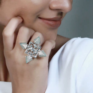 SILVER TONED DOTTED RHOMBUS RING WITH COILED CYAN ACRYLIC TRIANGLES WORN BY MALAVIKA NAIR