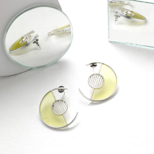 SILVER TONED SEMI-CIRCULAR STUDS WITH YELLOW ACRYLIC ARC & TWIST LINED CIRCLE