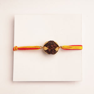 22K GOLD PLATED RUDRAKSH BEAD RAKHI WITH LUXURIOUS PETAL AND RED AND YELLOW TIEUPS