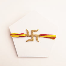 Load image into Gallery viewer, SWASTIK 22K GOLD PLATED RAKHI WITH MAROON AND YELLOW TIEUPS
